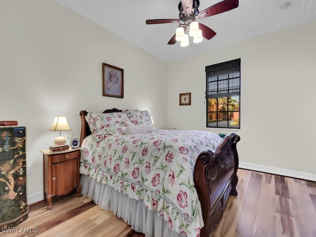 bedroom featuring ceiling fan and light hardwood / wood-style floors