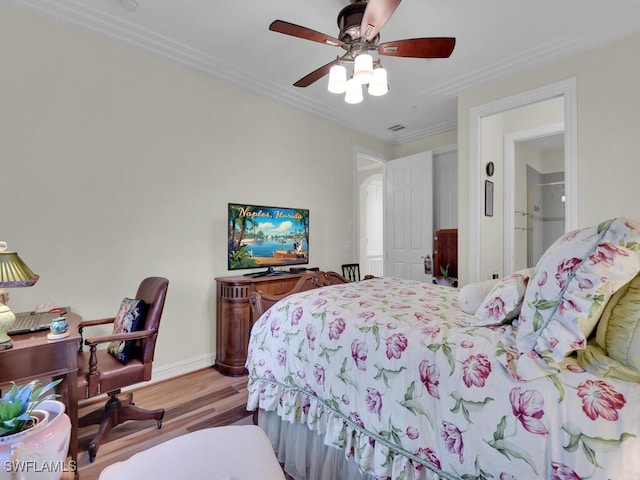 bedroom featuring crown molding, ceiling fan, and light hardwood / wood-style flooring