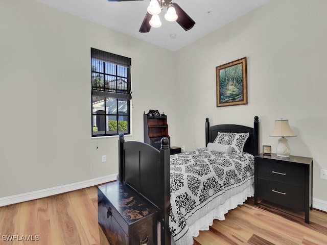 bedroom with light hardwood / wood-style flooring and ceiling fan