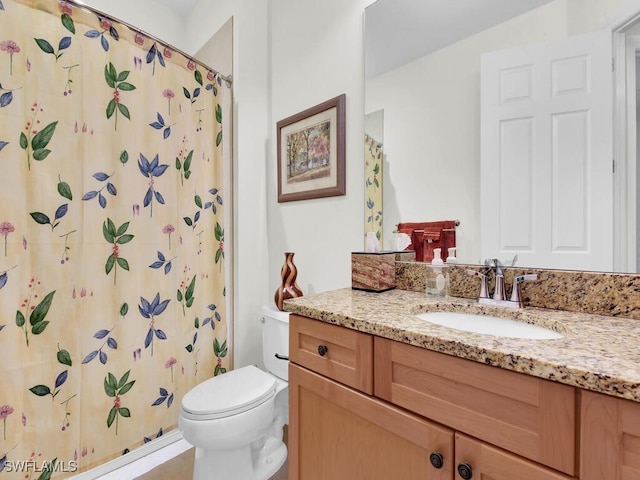 bathroom with vanity, a shower with curtain, and toilet