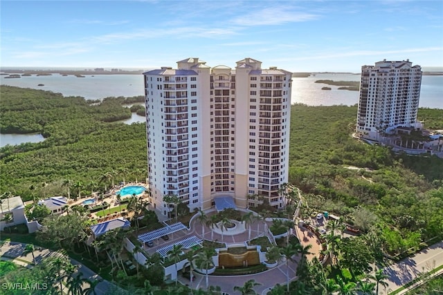 birds eye view of property with a water view