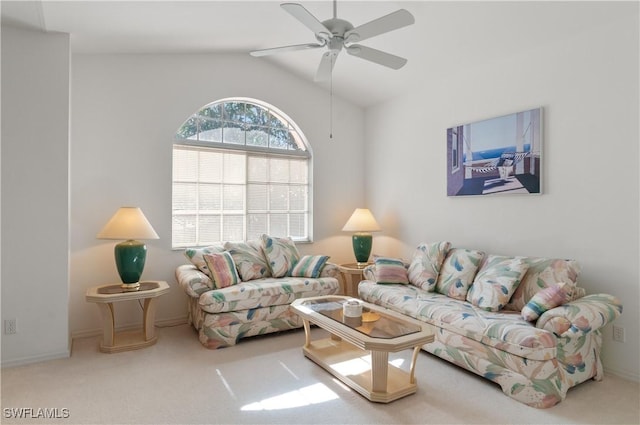 carpeted living room featuring lofted ceiling and ceiling fan