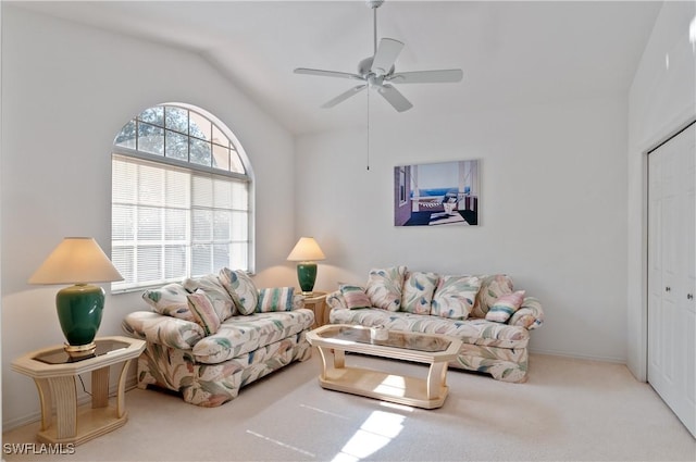 carpeted living room featuring lofted ceiling and ceiling fan