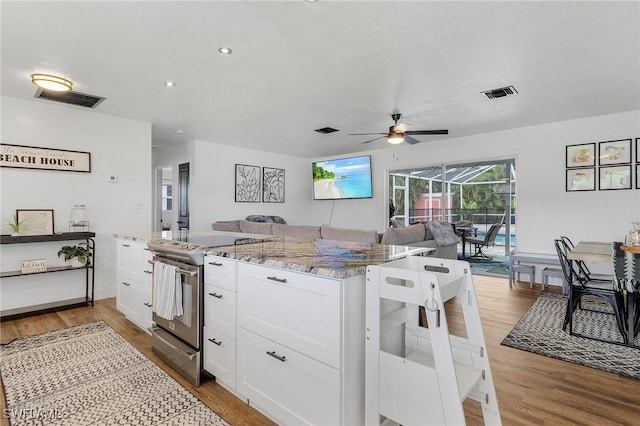 831 Lake Mcgregor Dr, Fort Myers, FL 33919 - kitchen featuring open floor plan, stainless steel electric stove, visible vents, a ceiling fan, and light stone countertops