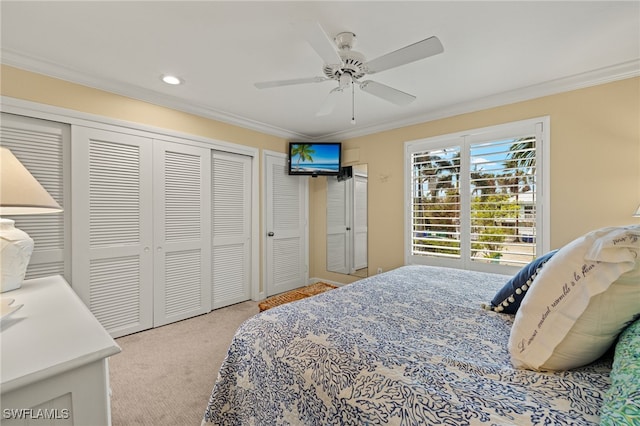 bedroom with crown molding, ceiling fan, and light colored carpet