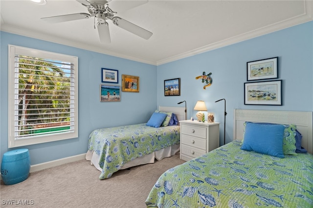 bedroom featuring crown molding, light carpet, and ceiling fan