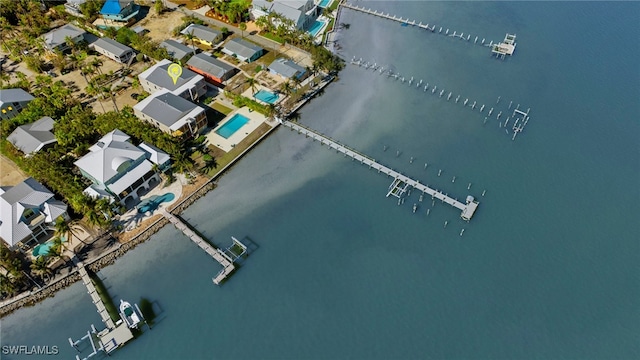 birds eye view of property featuring a water view