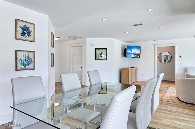 dining space with light wood-type flooring