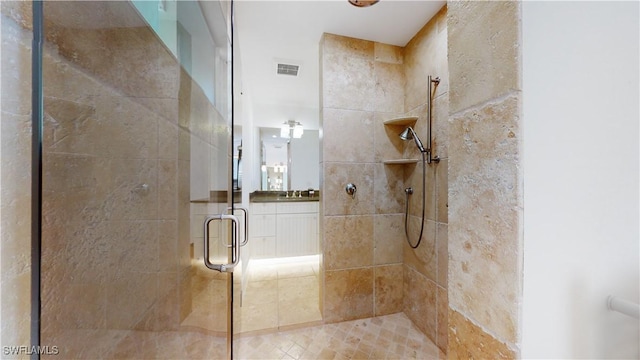 bathroom with walk in shower and sink