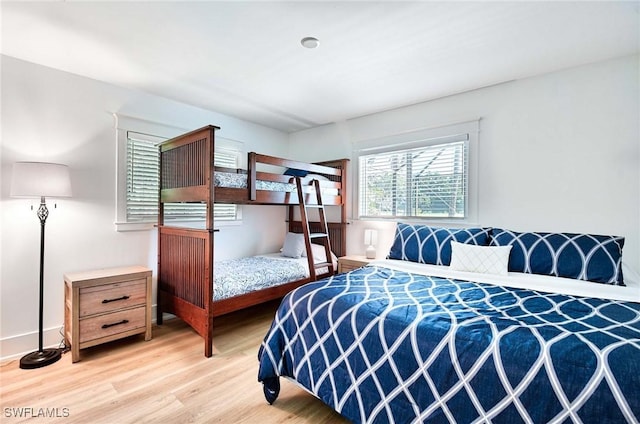 bedroom with light wood-type flooring