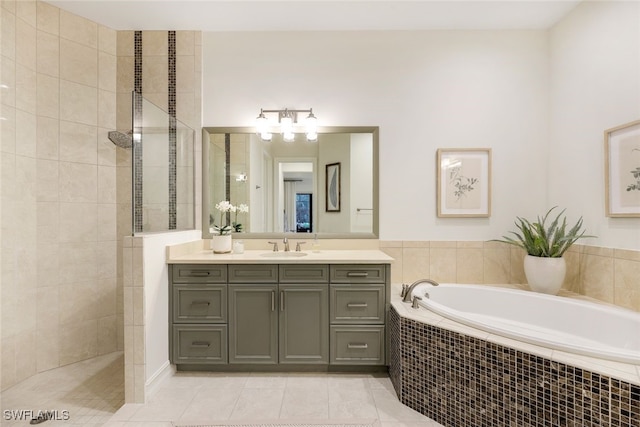 bathroom featuring tile patterned flooring, vanity, and plus walk in shower