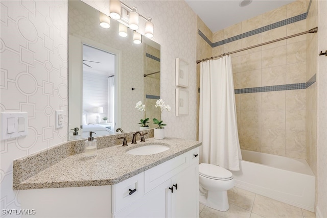 full bathroom featuring vanity, toilet, tile patterned flooring, and shower / bath combo