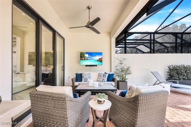 view of patio / terrace featuring outdoor lounge area, ceiling fan, and glass enclosure