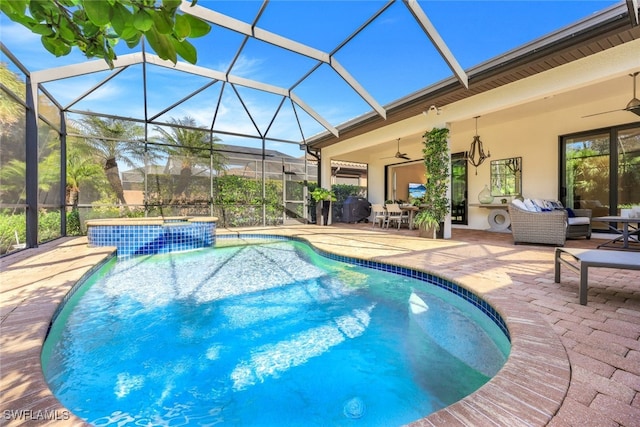 view of swimming pool featuring ceiling fan, an outdoor living space, a lanai, and a patio area