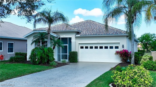 view of front facade featuring a garage and a front lawn