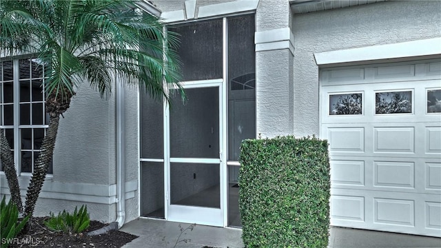 entrance to property featuring a garage