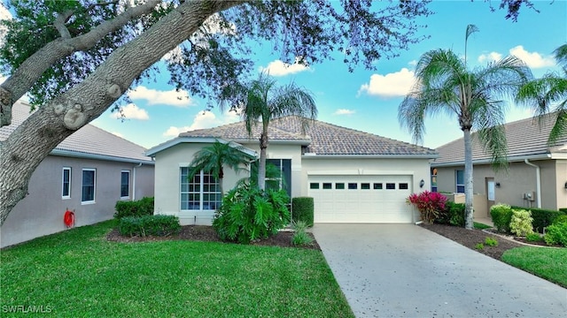 view of front of home with a garage and a front yard