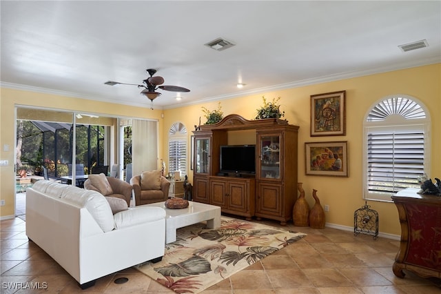 living room featuring light tile patterned flooring, ceiling fan, and ornamental molding