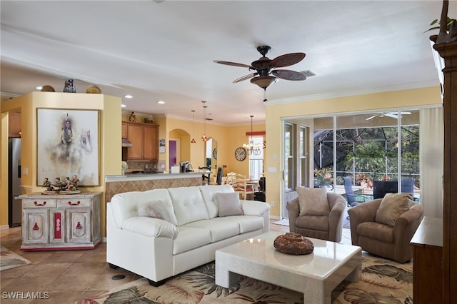 tiled living room with crown molding and ceiling fan with notable chandelier