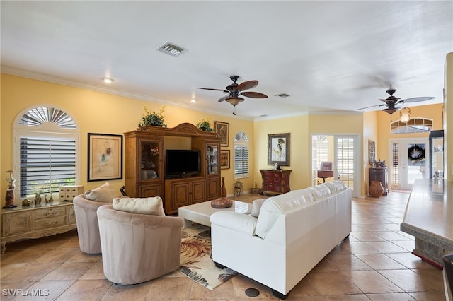 tiled living room featuring crown molding and ceiling fan