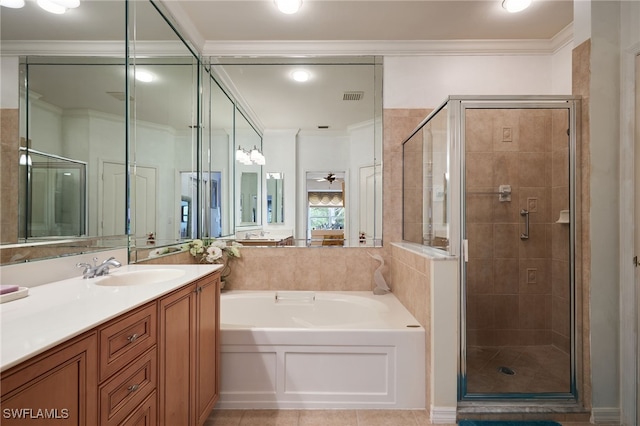 bathroom with ornamental molding, shower with separate bathtub, tile patterned flooring, and vanity