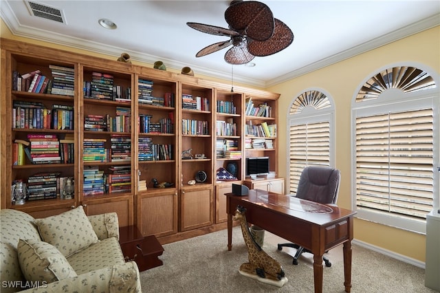 office featuring crown molding, ceiling fan, and light carpet