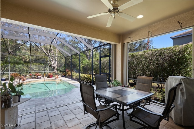 view of patio / terrace with area for grilling and glass enclosure