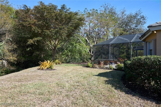 view of yard featuring glass enclosure