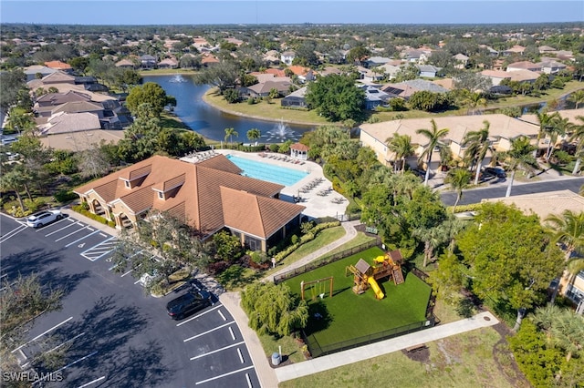 birds eye view of property with a water view