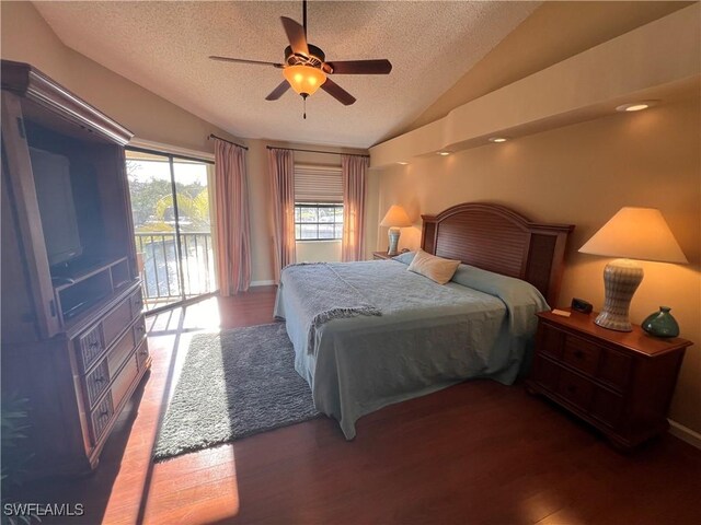 bedroom featuring lofted ceiling, a textured ceiling, dark hardwood / wood-style floors, ceiling fan, and access to exterior