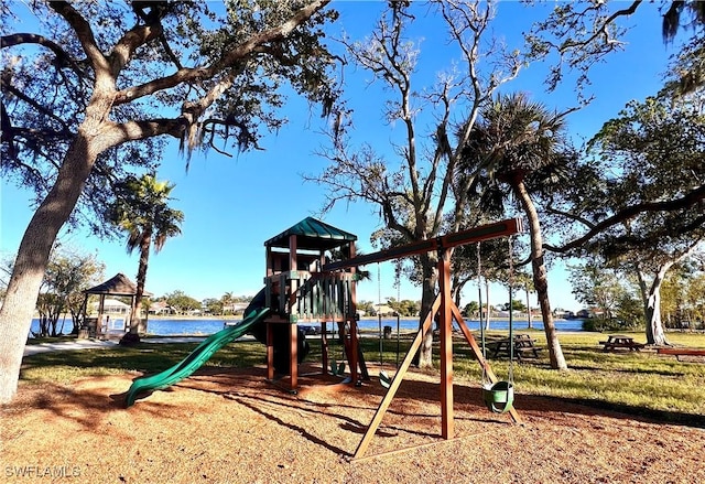 view of jungle gym featuring a water view