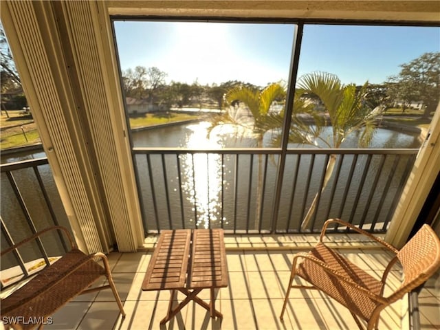 balcony featuring a water view