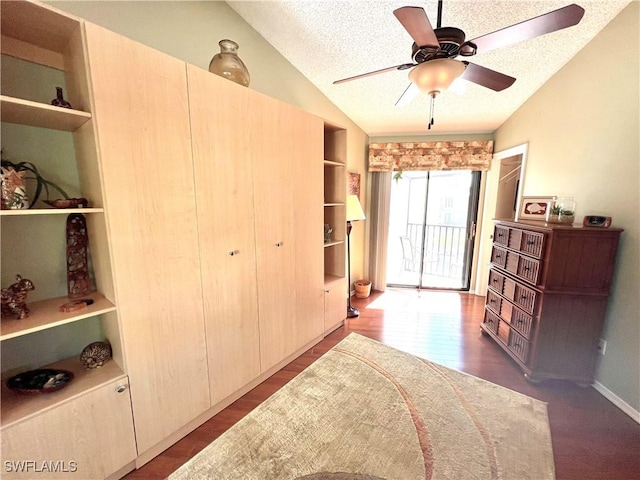 bedroom with lofted ceiling, hardwood / wood-style flooring, ceiling fan, access to exterior, and a textured ceiling