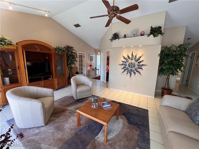 tiled living room featuring rail lighting, high vaulted ceiling, and ceiling fan