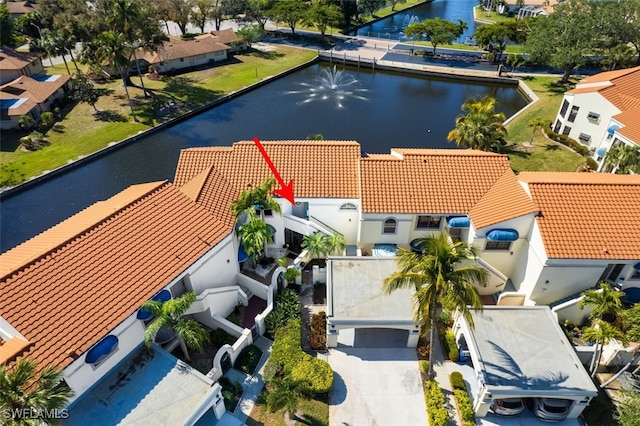 birds eye view of property featuring a water view