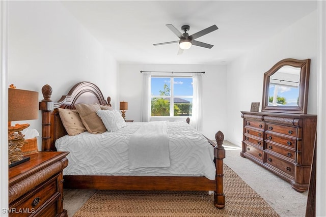 bedroom with ceiling fan and carpet flooring