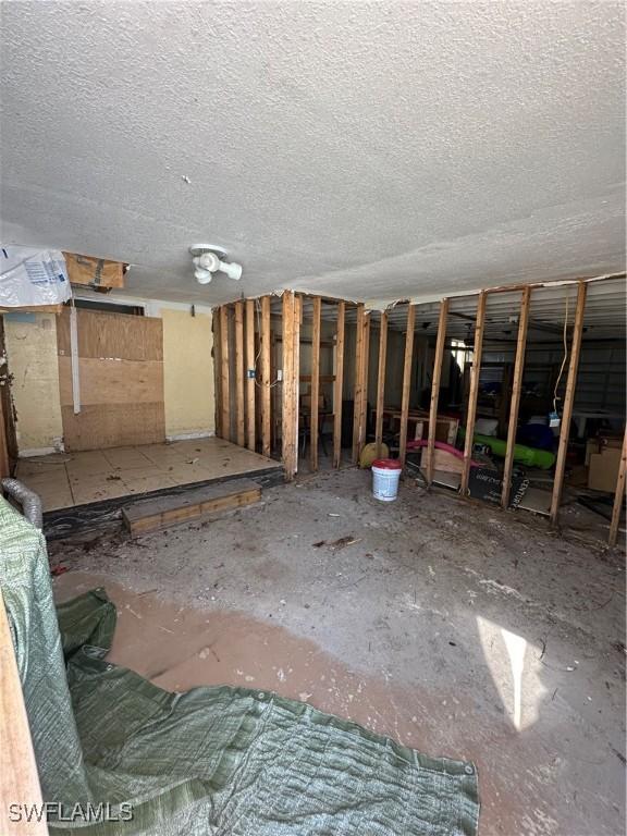 miscellaneous room featuring a textured ceiling