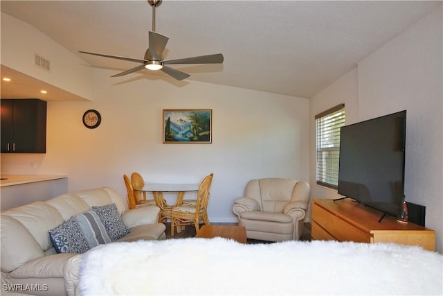 living room featuring lofted ceiling and ceiling fan