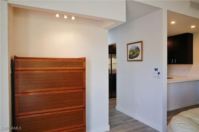 hall with light wood-type flooring