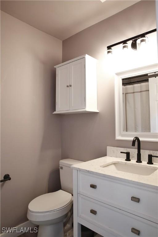 bathroom with vanity and toilet