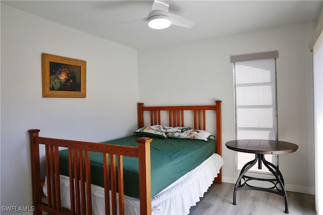 bedroom featuring hardwood / wood-style flooring and ceiling fan