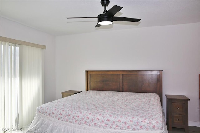 bedroom with ceiling fan and multiple windows