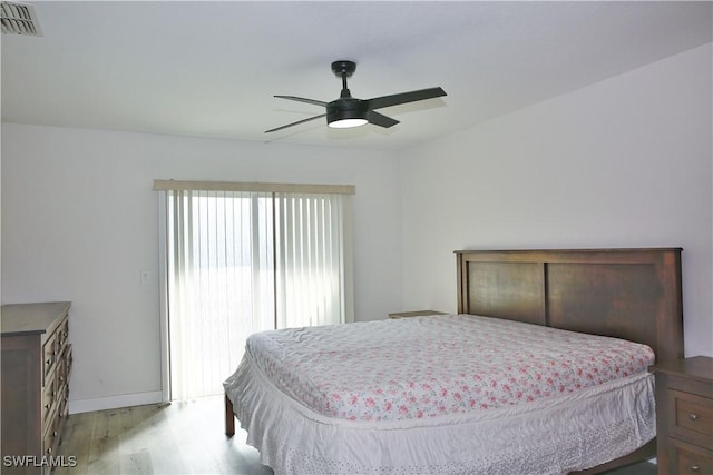 bedroom with ceiling fan and light wood-type flooring