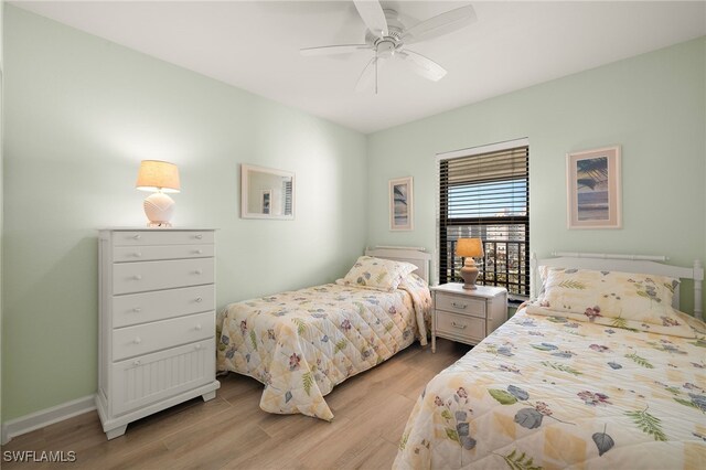 bedroom with ceiling fan and light hardwood / wood-style floors