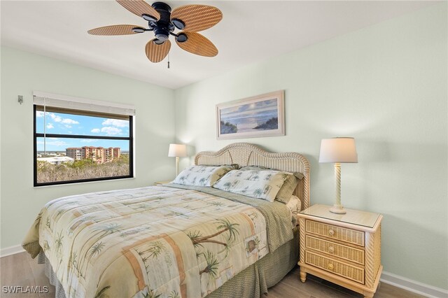 bedroom featuring hardwood / wood-style floors and ceiling fan