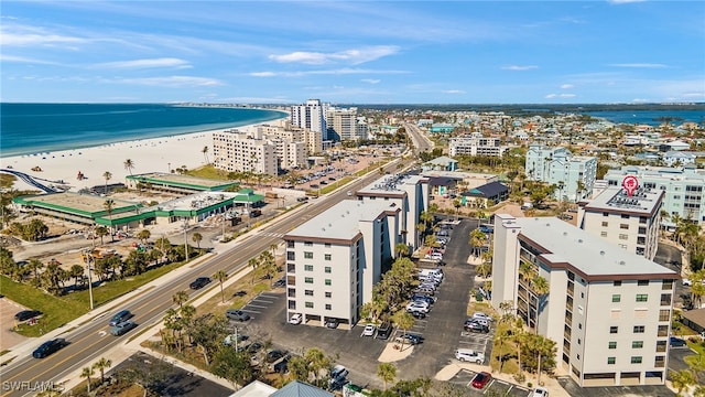 bird's eye view with a view of the beach and a water view