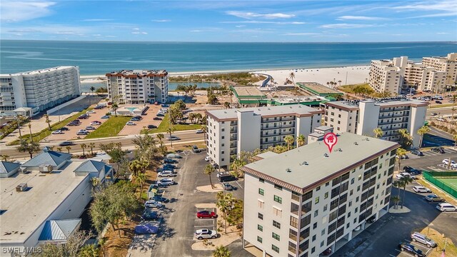 bird's eye view with a view of the beach and a water view