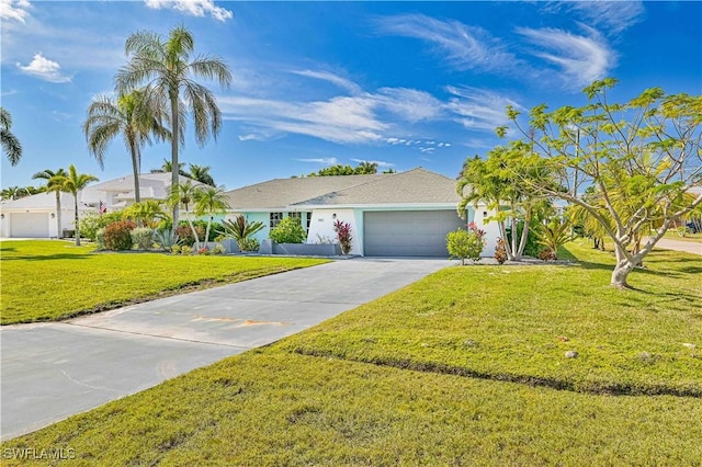 ranch-style home featuring an attached garage, concrete driveway, and a front yard