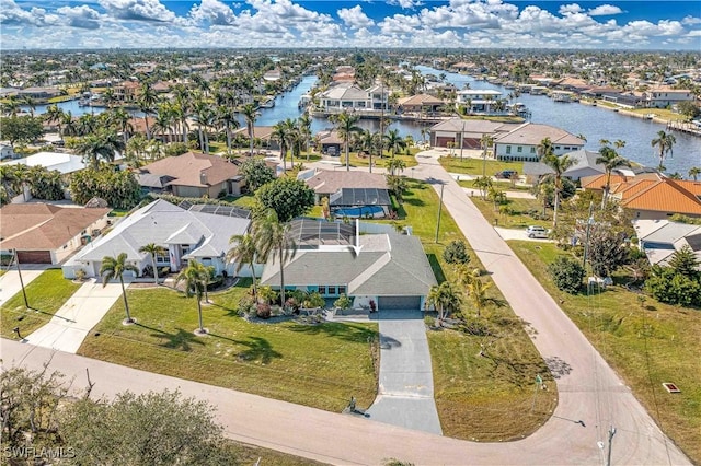 bird's eye view with a water view and a residential view