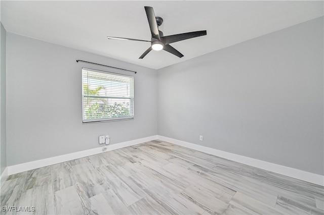 spare room with ceiling fan